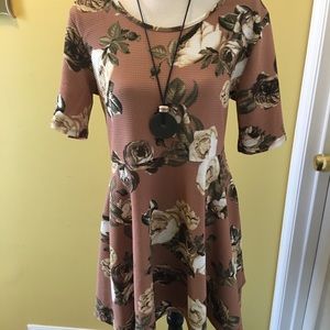 Tan and floral dress.
